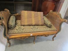 A gilded ormolu bergere day bed.