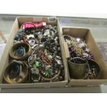 A mixed lot of costume jewellery, necklaces, chains etc. in 2 boxes.