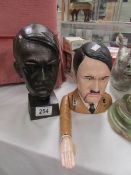 A cast bust and a novelty money bank of Adolf Hitler.