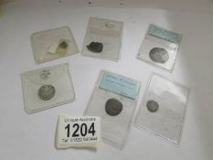 A small collection of hammered silver coins including Edward III and Henry III.