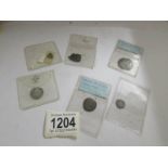 A small collection of hammered silver coins including Edward III and Henry III.