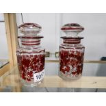 A pair of ruby flashed cut glass pickle jars.