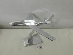 A chromed model airplane,
