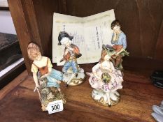 4 Capo di Monte figures of children with accompanying paperwork.