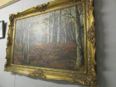 A gilt framed oil on canvas forest scene signed D A Everitt