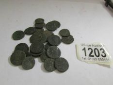 A collection of 25 Roman coins.