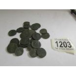 A collection of 25 Roman coins.