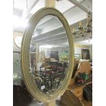 A Victorian oval mirror.