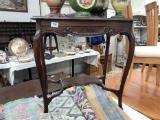 A mahogany occasional table.