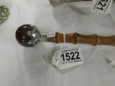 A ladies walking stick with silver and Scottish agate top.