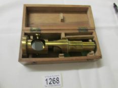 A late 19th century brass field microscope with box. (no maker's marks).