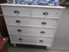 A 2 over 3 painted chest of drawers.