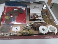 A mixed lot including Butlin's badges, coins, medallions, ARP whistles, mouth pieces,