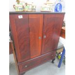 A mahogany effect TV cabinet.