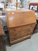 A bureau with 3 drawers.