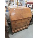 A bureau with 3 drawers.