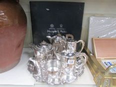 A 4 piece silver plate tea set on tray.