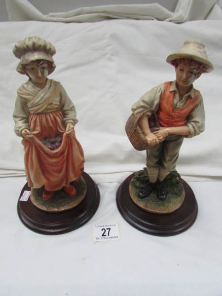 A pair of Leonardo figurines.