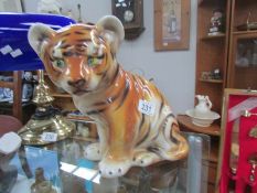 A ceramic tiger cub.