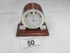 A miniature mantle clock with silver mounts hall marked London.
