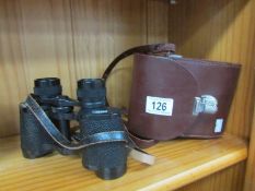 A cased pair of Carl Ziess 8 x 30 binoculars.