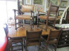 An oak extending dining table and 5 chairs.