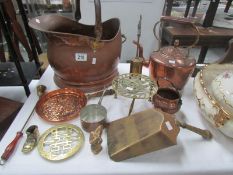 A mixed lot of copper and brass including coal scuttle, kettle etc.