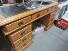 A pine double pedestal desk.