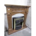 A fire surround with inset fire.