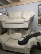 A pair of good quality 2 seat cream sofa's with cushions.