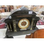 A black slate mantel clock with silver dedication, both springs ok but wound to limit. (no key).