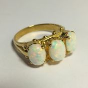 A large 3 stone 9ct gold opal ring, size O.