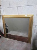 A gilt framed mirror.