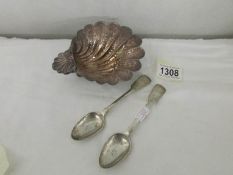 A chased silver shell dish and 2 silver tea spoons.