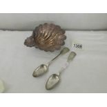 A chased silver shell dish and 2 silver tea spoons.