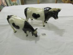 A pottery bull and a pottery cow (no makers marks).
