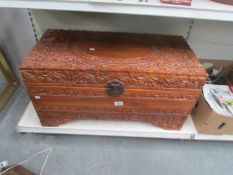 A carved camphor wood chest.