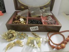 A mixed lot of costume jewellery in jewellery b ox.