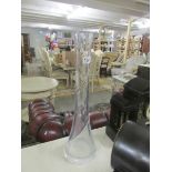 A good quality tall glass vase.