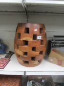 A drum shaped wooden stool,.