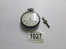 A silver pocket watch (J.G.Greaves).