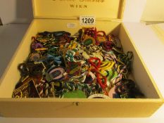 A collection of in excess of 70 metal and enamel horse racing badges.