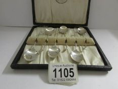 A cased set of 6 'golf club' silver teaspoons, Birmingham 1983.