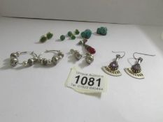 A pair of vintage turquoise ear pendants, two pairs of silver earrings (one hoop,