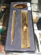 A boxed gold coloured Benson & Hedges pen and ruler set.