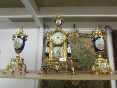 A 3 piece contemporary clock garniture with battery movement.