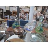 A collection of paperweights including signed Mdina examples.