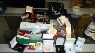 A large mixed lot of costume jewellery and watches including pendants, necklaces, earrings,