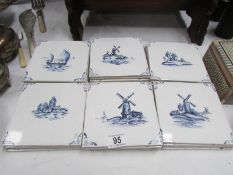 Approximately 25 Delft tiles.