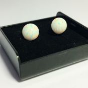 A pair of 9ct gold opal set earrings.